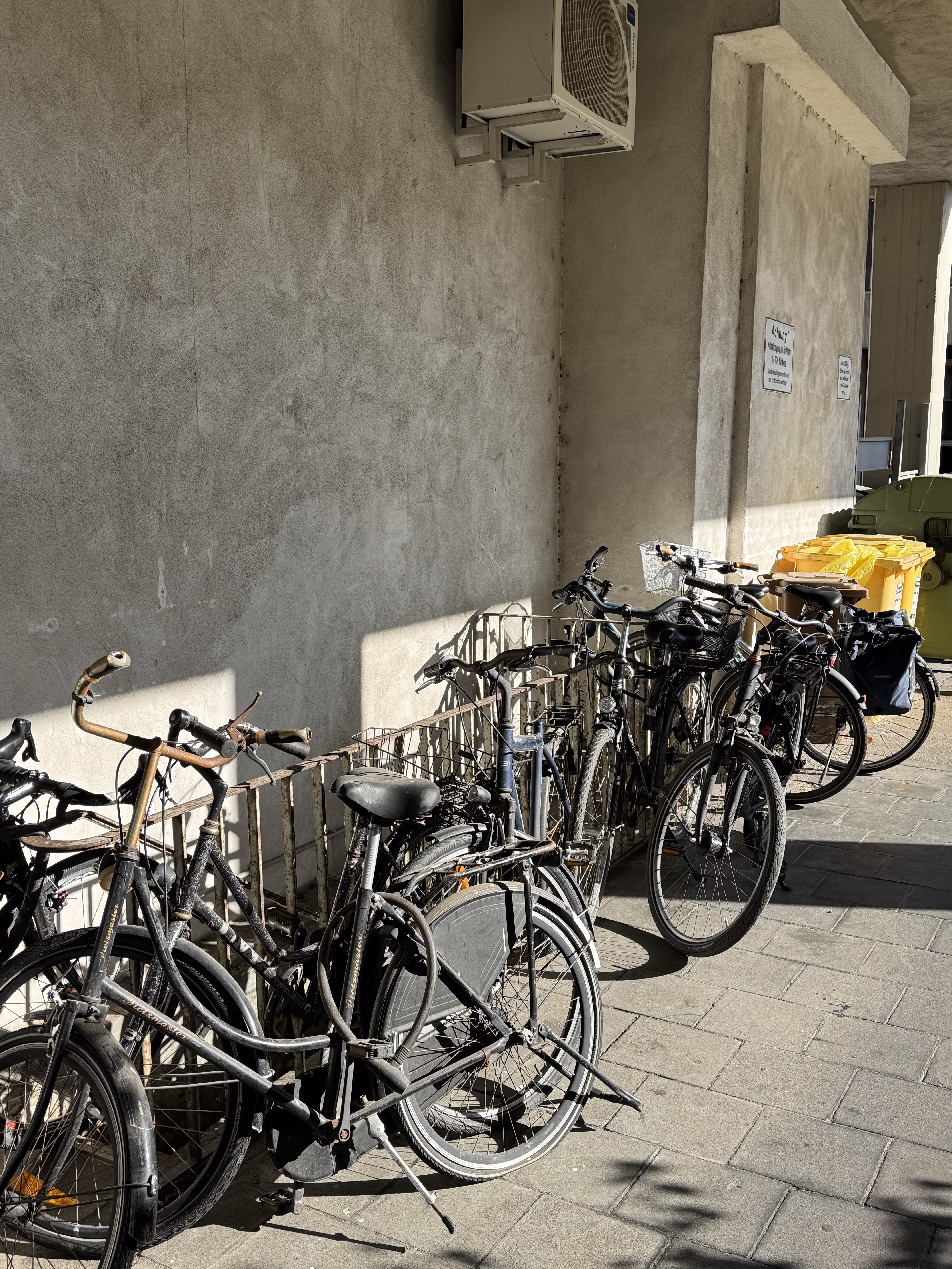 Bicycles against a concrete wall